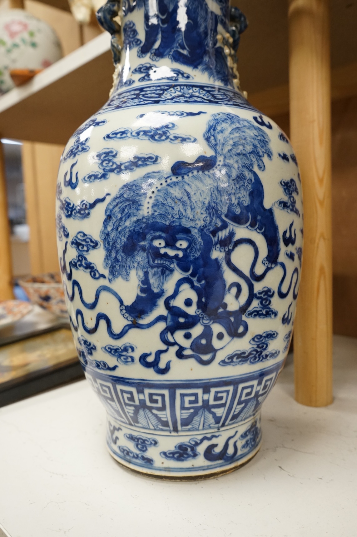 A Chinese baluster vase, painted with Buddhist lions in underglaze blue, 45cm high